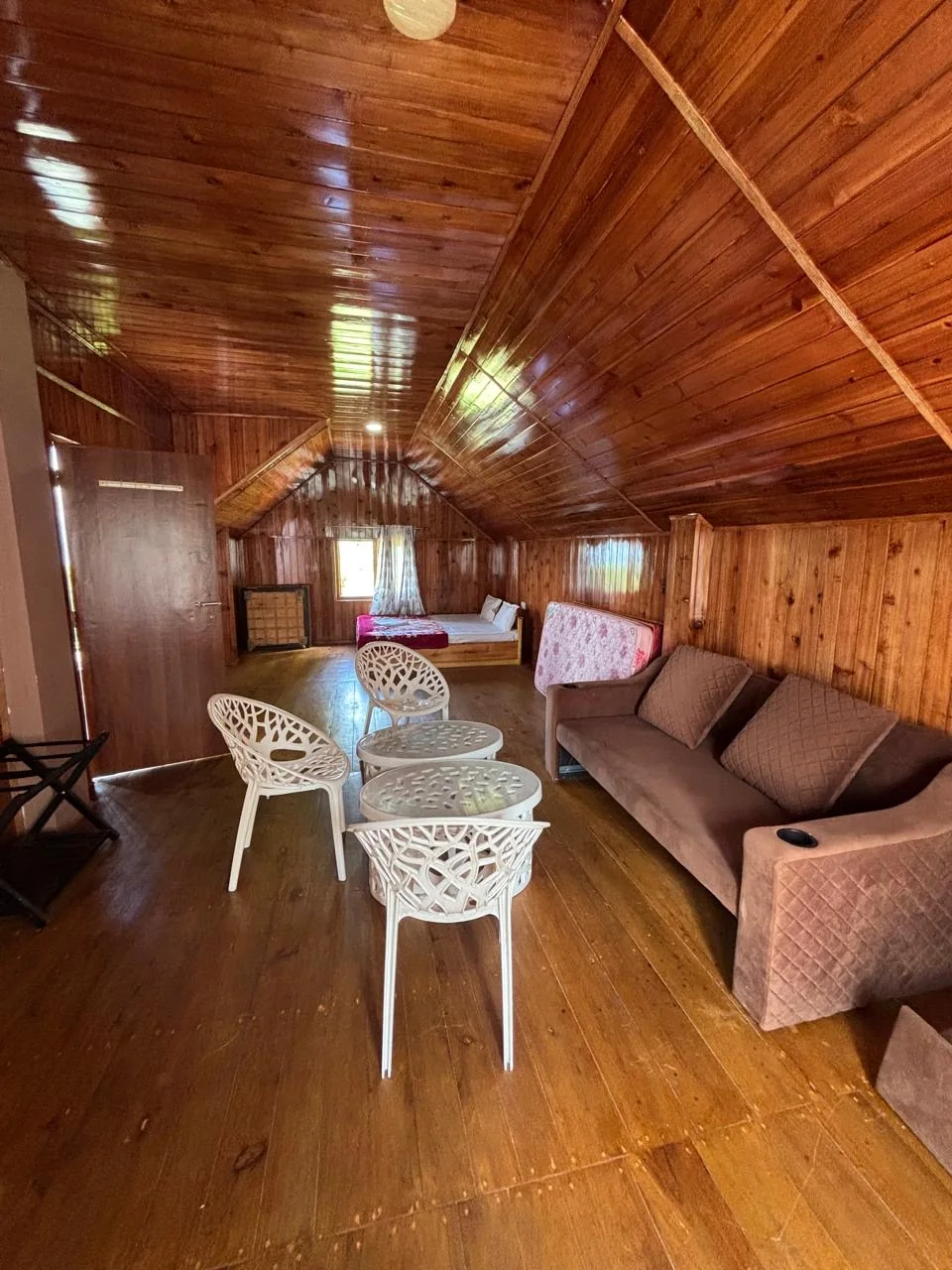 Wooden attic lounge at Tashi Ville Farmstay