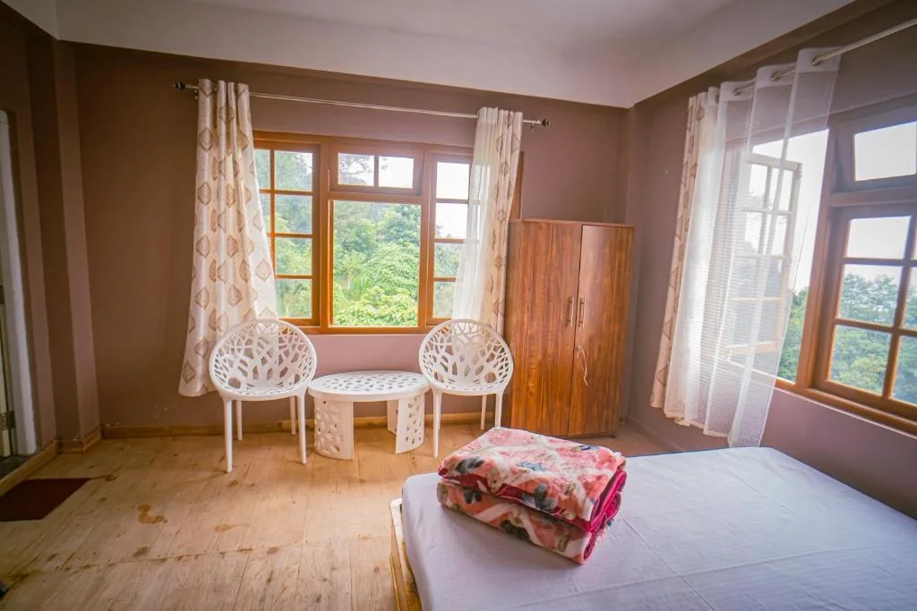 Bright guest room at Tashi Ville Farmstay in Lamahatta